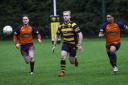 Man-of-the-match Luke Turner scored three of Ely's six tries as he races after a ball.