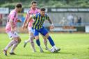 Ross Crane in possession for the Linnets