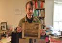 Christopher Woods, from James & Sons in Fakenham, holding up some of the letters which are up for auction