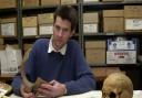 A proud moment: Dr Neil Faulkner with some of the artefacts discovered at the site of the Sedgeford archeological dig