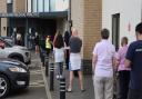 Patients queue at the Fakenham Medical Practice (photo taken in 2021)