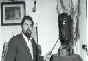 Mr Howard with the carved head of the god Atho, left to him by an old Romany woman.