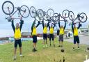 The 'Norfolk Fellaton' charity cycling team celebrates reaching John O'Groats in Scotland. From left: Mike Bartlett, Nick Gowing, Justin Morfoot, Ed Wharton, Ed Masters, Richard Hirst