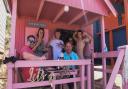 Holidaymakers enjoying one of the beach huts at Wells beach. Picture: Danielle Boode