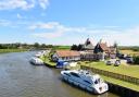 Acle Bridge Inn, Acle Bridge.  The pub viewed from the bridge next to the River Bure.  Credit: James Bass