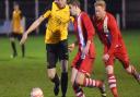 Action from Fakenham's 6-3 defeat against Newmarket, red, on Saturday. Picture: IAN BURT