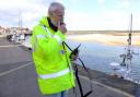 John Cheketts with one of the wardens' new radios.