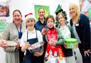 Sandie Toher (rear middle), chairman of the Friends of Fakenham Junior School, joined staff from The Nottingham and school pupils Taylor, Lewis and Bethany to celebrate the donation