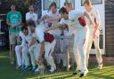 The alcohol flows as Fakenham celebrate winning the title. Picture: RONNIE HEYHOE