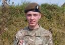 Lance Corporal Tyler Barker with his coin