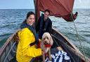 Couple Kelly Brook and Jeremy Parisi with dog Teddy on their Norfolk boat trip