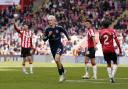 Manchester United’s Alejandro Garnacho celebrates after scoring his side’s third goal (PA)