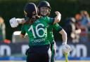 Christina Coulter Reilly, right, celebrates with Leah Paul after hitting the winning runs against England (Damien Eagers/PA)