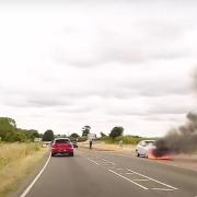 A car became engulfed in flames after pulling over into a layby on a Norfolk Road