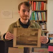 Christopher Woods, from James & Sons in Fakenham, holding up some of the letters which are up for auction