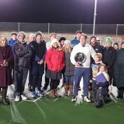 James Buddell (centre, with shield) and volunteers at North Elmham tennis club after he was awarded Norfolk LTA Volunteer Award