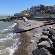 The beach at Sheringham. As part of the lockdown easing the government's message will go from 'stay at home' to 'minimise travel' on March 29. But some say more clarity is needed over how far this means people will be able to travel.