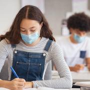 The government's announcement came on Sunday to reintroduce masks into classrooms in secondary and higher educational settings. Picture: Getty Images/iStockphoto