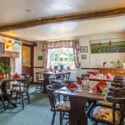 The main dining room, to the left of the entrance to the pub