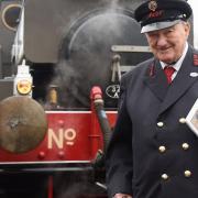 Alan Baker, 89, at the Whitwell and Reepham Station with his book 'A Life on the Rails'. Picture: DENISE BRADLEY