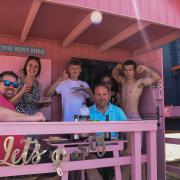 Holidaymakers enjoying one of the beach huts at Wells beach. Picture: Danielle Boode