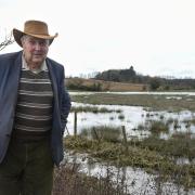 Peter Howell, a Norfolk cattle farmer whose grazing land alongside the River Wensum has been flooded since Christmas