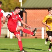 Despite all their problems Fakenham Town (amber) managed to field a side against Yelverton on Saturday. Picture: Nick Butcher