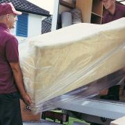 Men loading a removal van. Picture: Getty Images