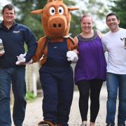 Paul Sandford, (L) landlord of the Railway Tavern in Dereham is organising a pub walk to raise money for military PTSD. Also pictured are (from left) Biscuit the Dereham Carnival mascot, Elaine Winterbone and Bruno Hipolito. Picture: Ian Burt