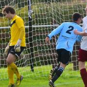 Anglian Combination Division One action between Bungay Town (blue) and Hempnall.