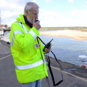 John Cheketts with one of the wardens' new radios.