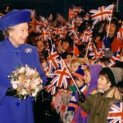 The Queen arrives at RAF Marham and is welcomed by local school children in 1996.