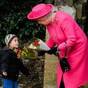 Ian's favourite image is of the Queen with his eldest son Freddie, at the age of 3. The Queen happily chatted to him at West Newton church.