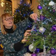 Setting up at the Fakenham Christmas Tree Festival in 2022. Penny Thornton from the Epilepsy Society