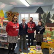 Duncan Baker (second from left) with staff at Astley Primary School in Melton Constable at the opening of its new library