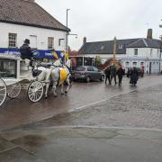 John ‘Jonathan’ Hollings's funeral procession through Fakenham was led by his husband Mark, and children Adam Hollings and Emma Marrison