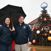 The crab pot Christmas tree returns to Wells Harbour. Pictured are Harbour Administrator Simon Cooper, and Harbour Admin Assistant Sallyann Retchless