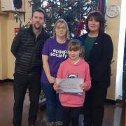 With Ava Buck, 9, are, from left, Swanton Morley VC Primary School headteacher Mr Richardson, mum erica Buck and and Mrs Wilton.