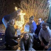 Sarah Holmes (back right) with partner Luke Cave (centre) holding baby Luke with Ryan, Lisa, and Mat from the Ebi Foundation, and Sarah’s daughter Zay (front)