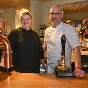 Emily Phipps and Richard Crouch behind the  bar at The Angel at Watlington Picture: Sonya Duncan