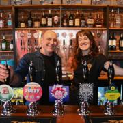 Hop Rocket co-owner Mark White and general manager Molly Taylor behind the bar Picture: Sonya Duncan