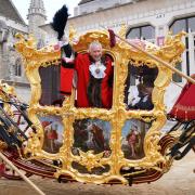 Nicholas Lyons waves from his state coach at the Lord mayor's Show in 2022