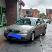 The Vauxhall driver was pulled over outside Lloyds Bank in Fakenham