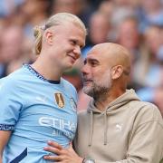 Manchester City’s Erling Haaland (left) is substituted and embraces manager Pep Guardiola during the Premier League match at the Etihad Stadium, Manchester. Picture date: Saturday August 24, 2024.