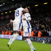 Christopher Nkunku celebrates with Chelsea team-mate Jadon Sancho at Bournemouth (Alastair Grant/AP)