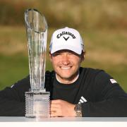 Denmark’s Rasmus Hojgaard poses with the Amgen Irish Open trophy following his win at Royal County Down (Peter Morrison/PA)