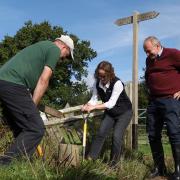 Liberal Democrat leader Sir Ed Davey with Mid Sussex MP Alison Bennett help The Monday Club volunteers (Will Durrant/PA)